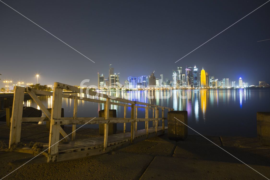 Doha Skyline with a brige towards the water