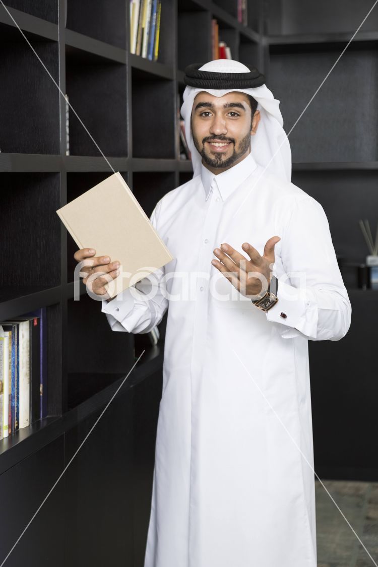 Arab man selecting a book