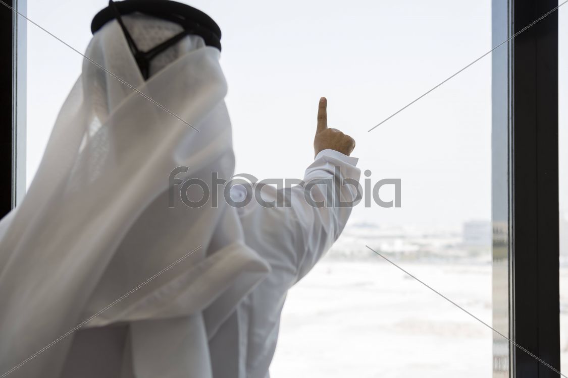 Arab man doing a hand sign