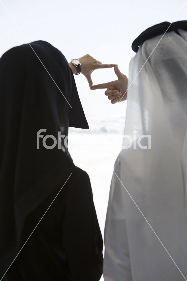 Arab man and woman working as a team