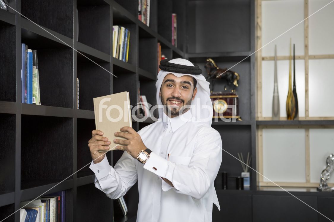 Arab man selecting a book