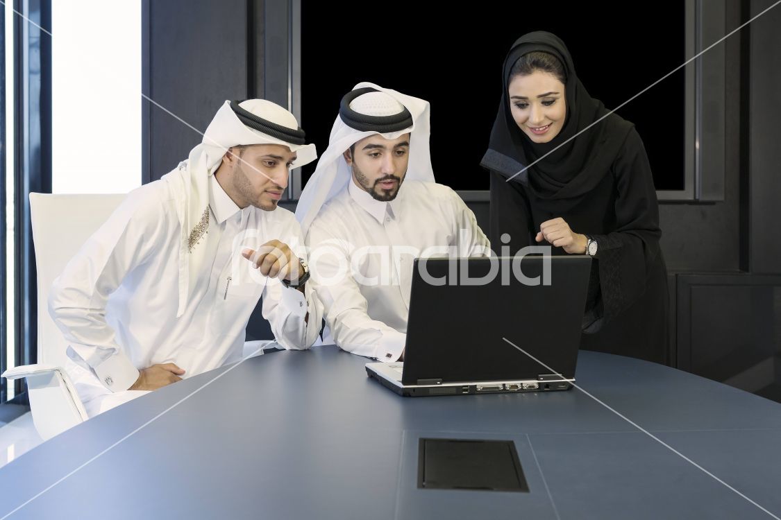Arab man and woman working as a team