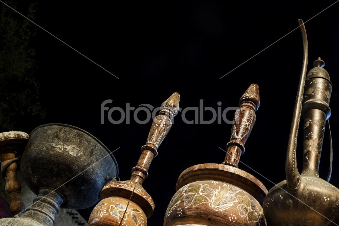 Arabic teapots, drinking cup and wooden jar