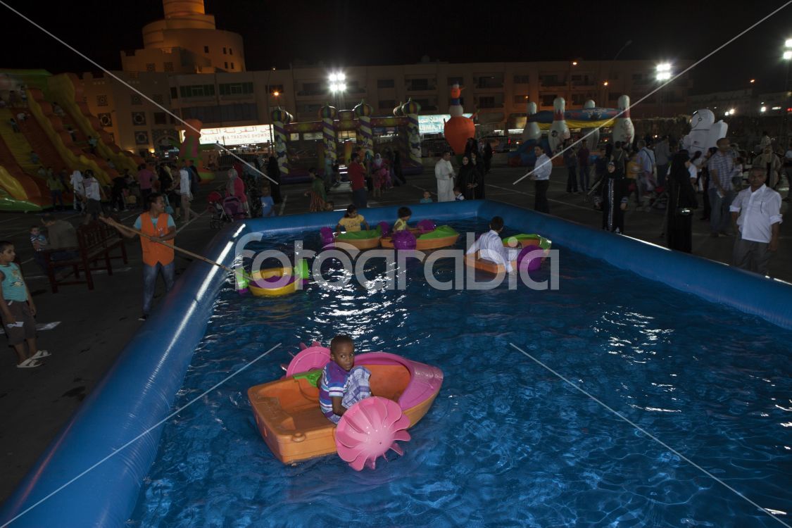 Kids playing in a pool during EID celebration