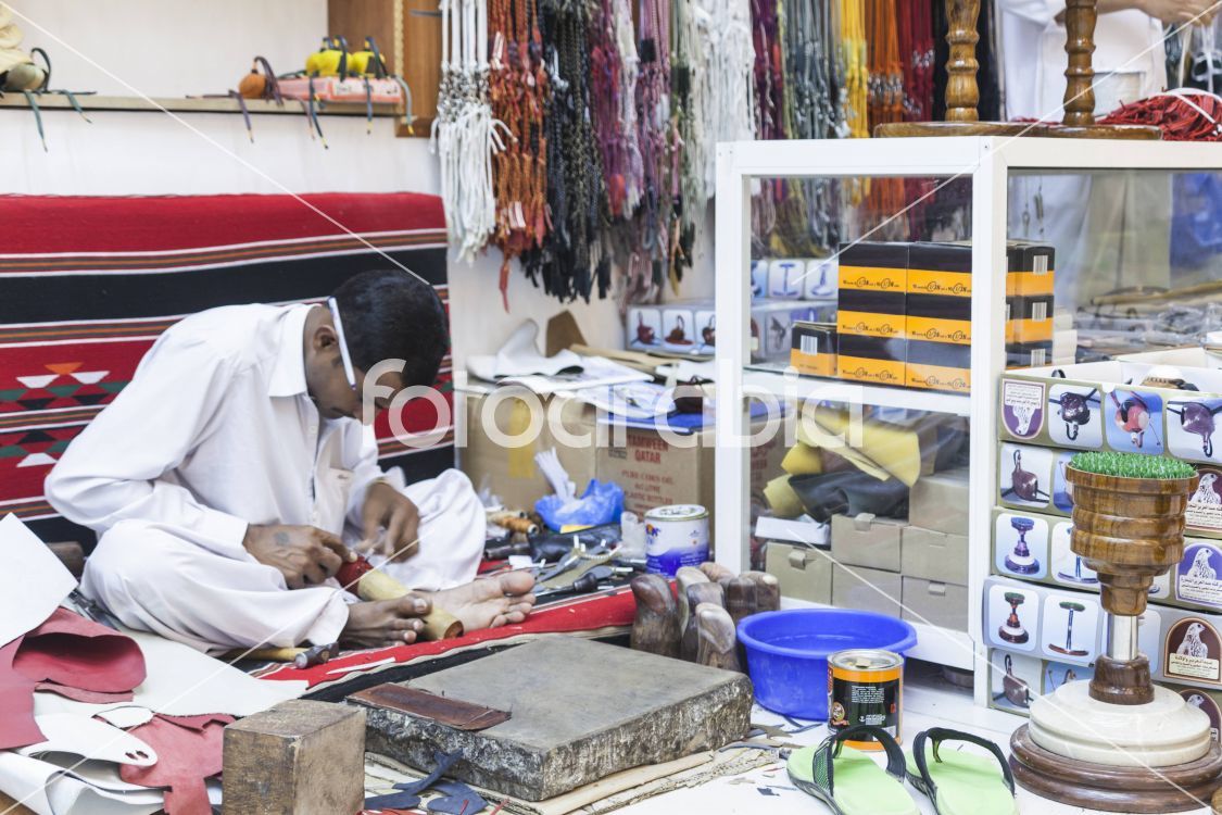 Man making a fanconry hood