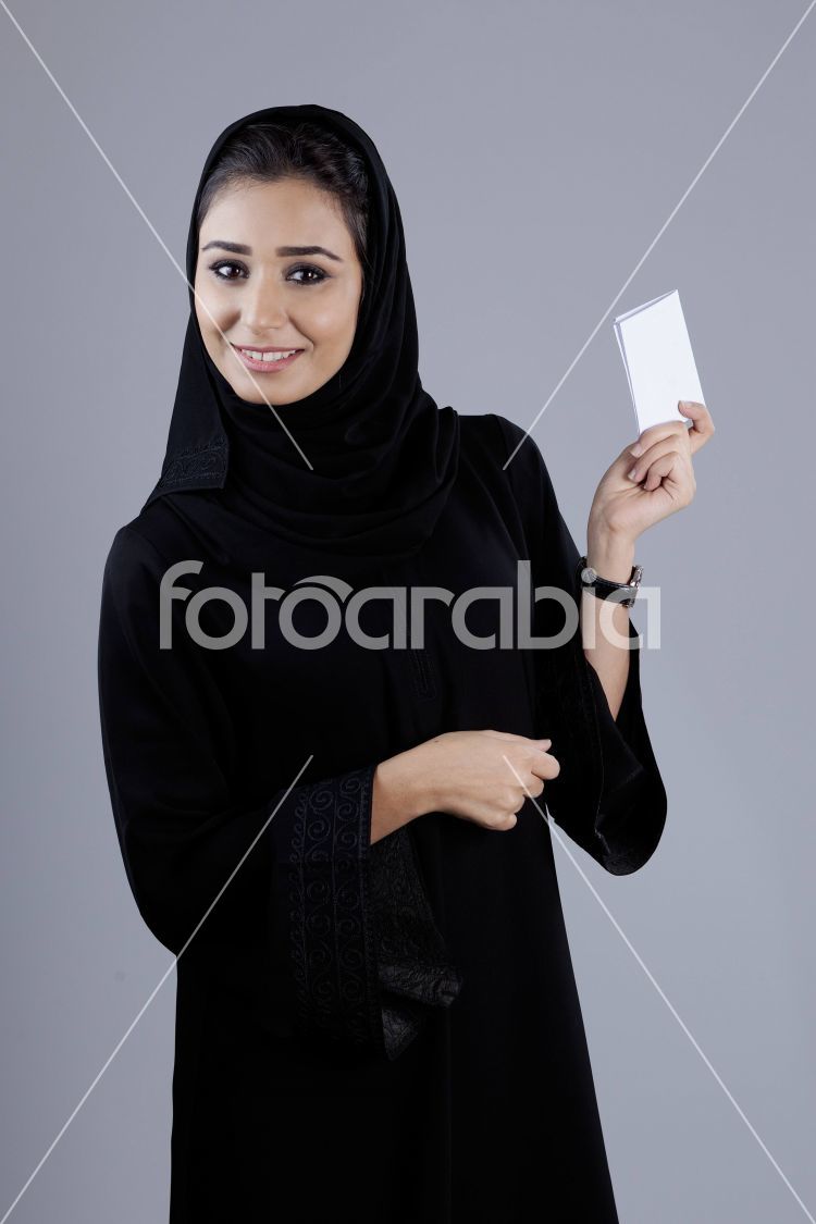 Arab businesswoman holding a plain white card
