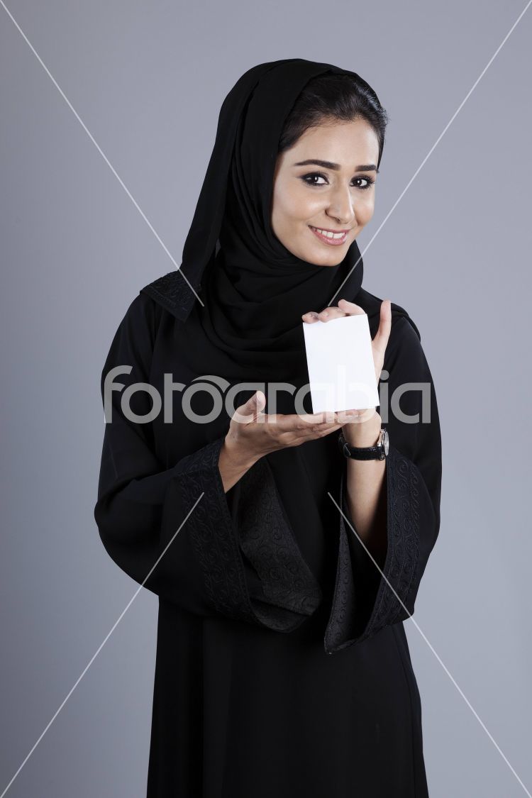 Arab businesswoman holding a plain white card
