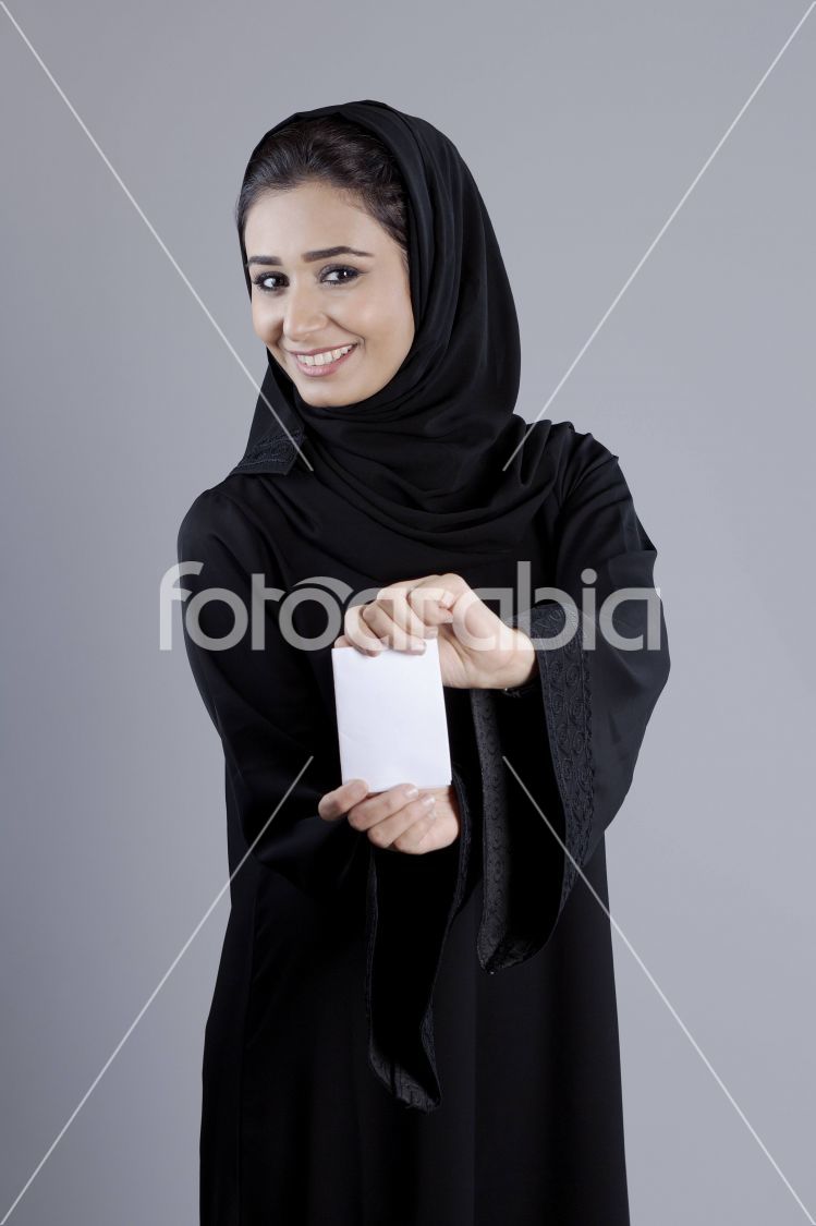 Arab businesswoman holding a plain white card