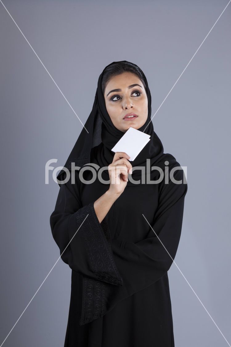Arab businesswoman holding a plain white card