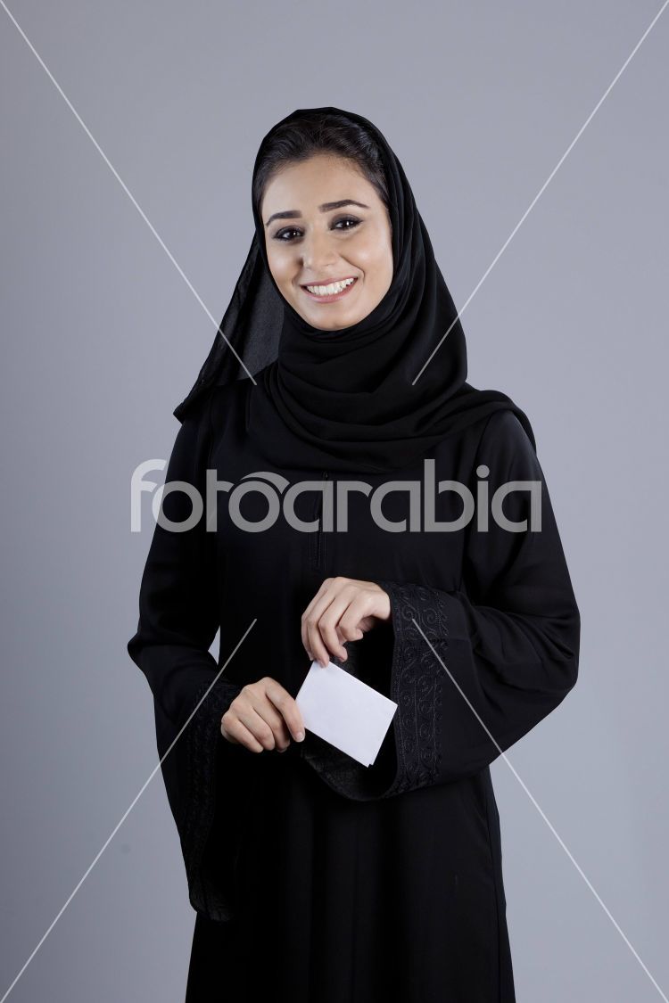 Arab businesswoman holding a plain white card