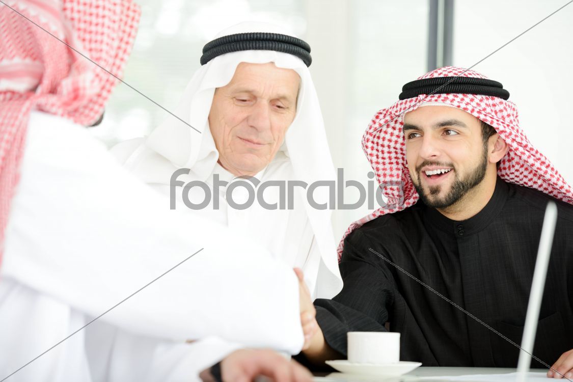 Arab business people shaking hands