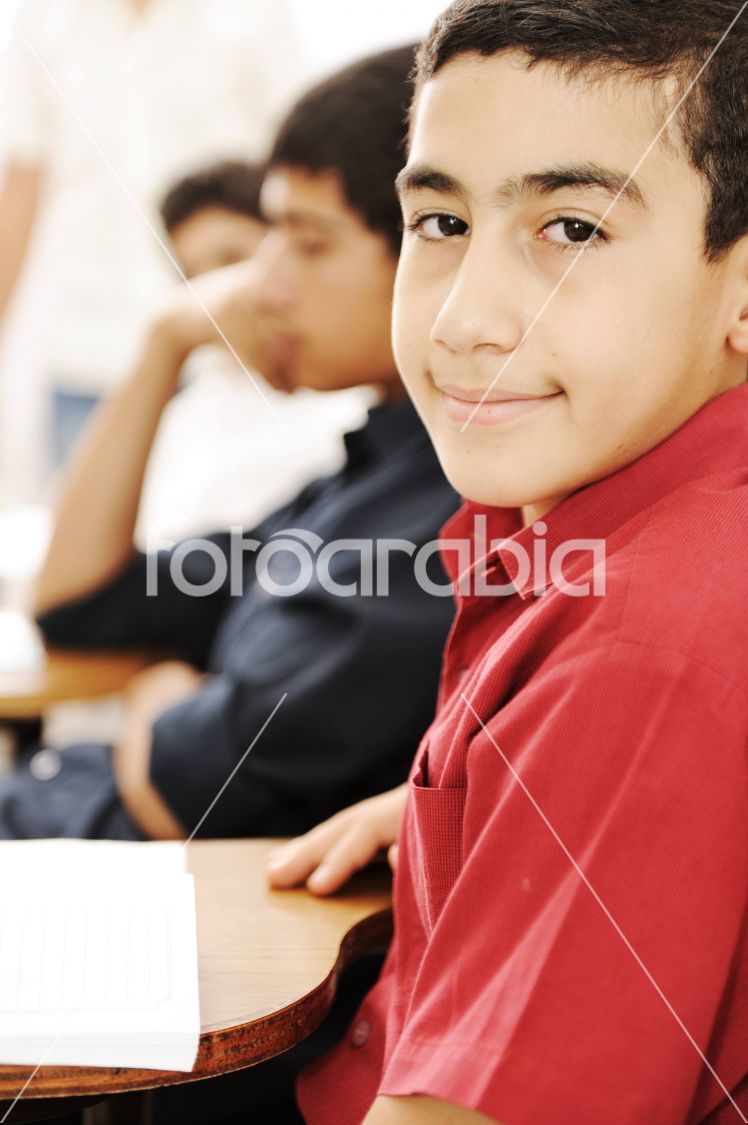 Happy children smiling and laughing in the classroom