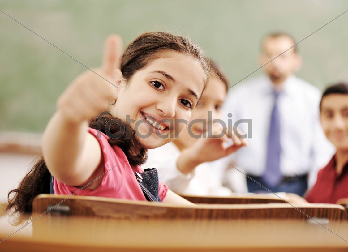 Happy children smiling and laughing in the classroom