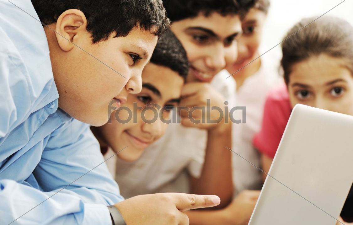 Happy children smiling and laughing in the classroom