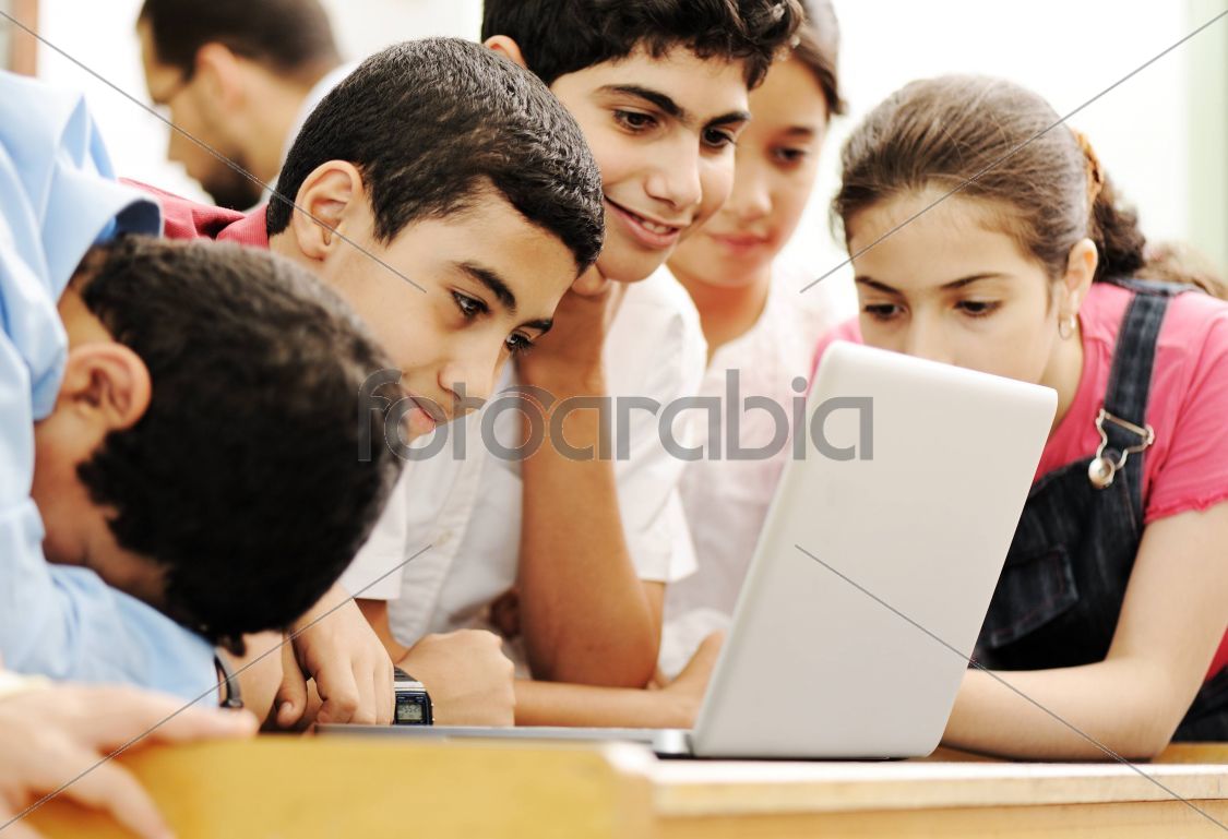 Happy children smiling and laughing in the classroom