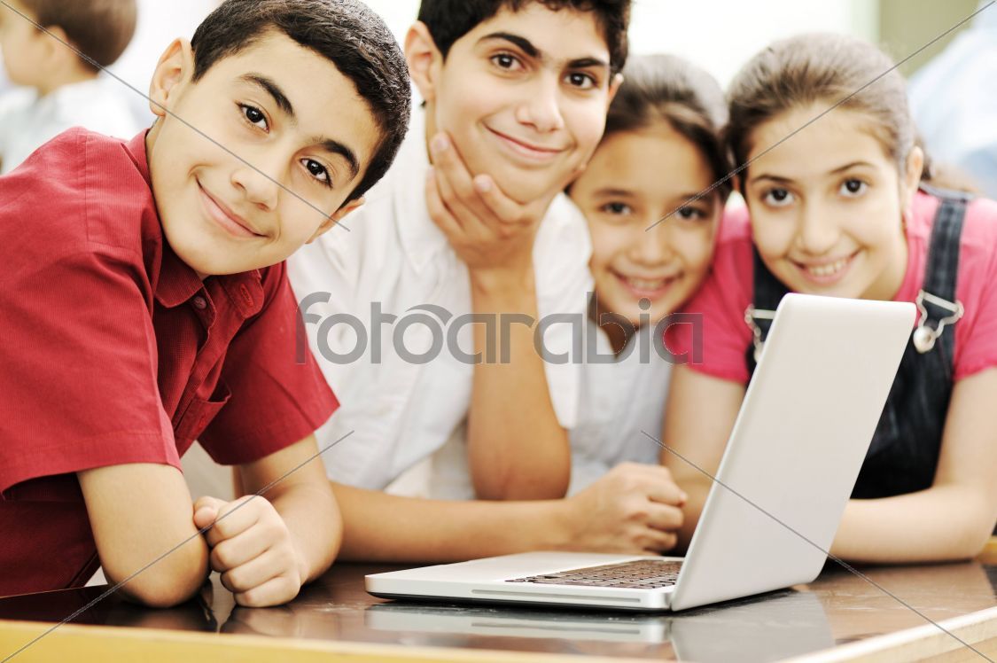 Happy children smiling and laughing in the classroom