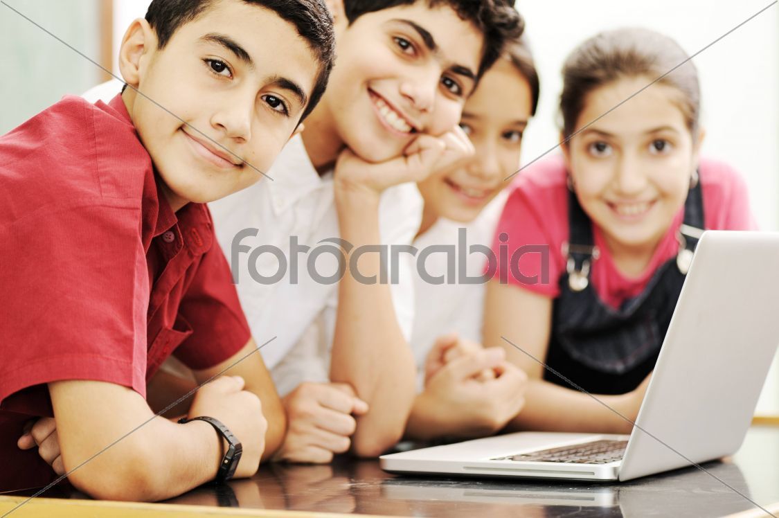 Happy children smiling and laughing in the classroom