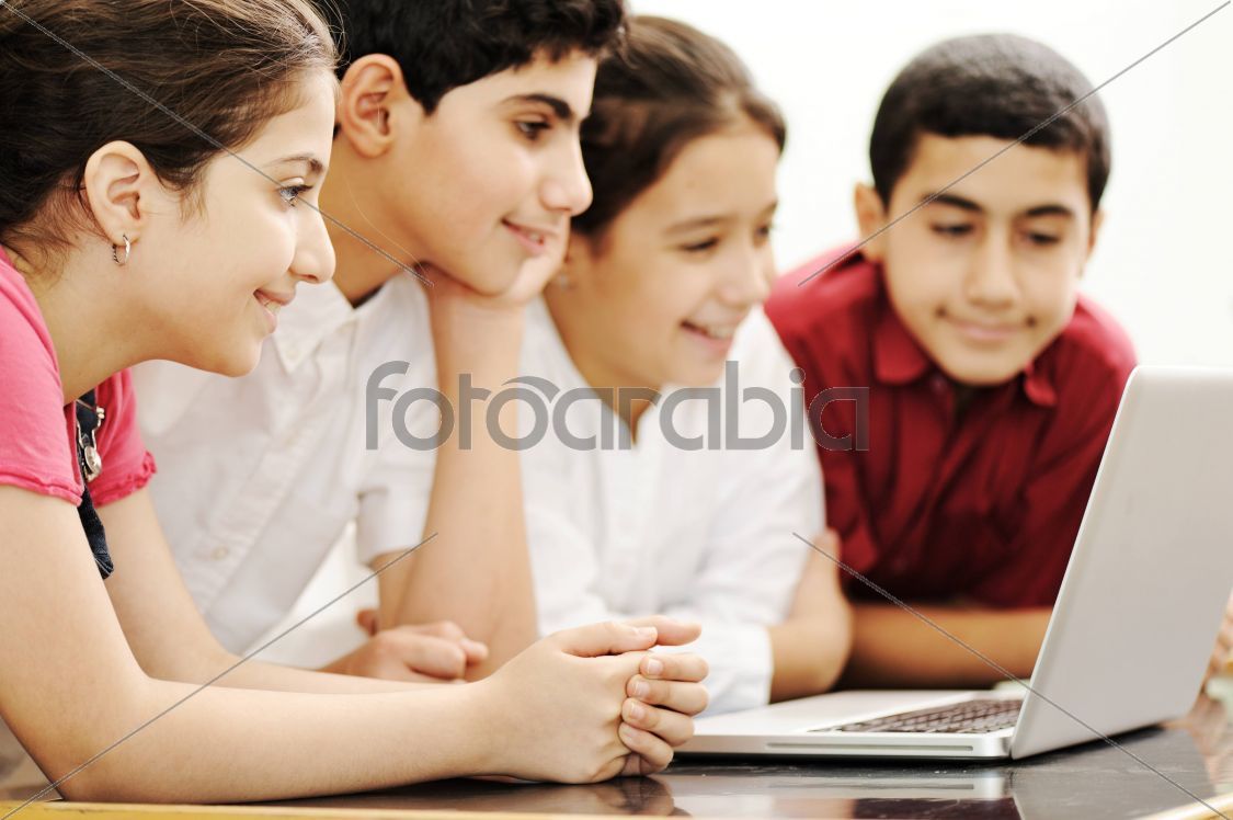 Happy children smiling and laughing in the classroom