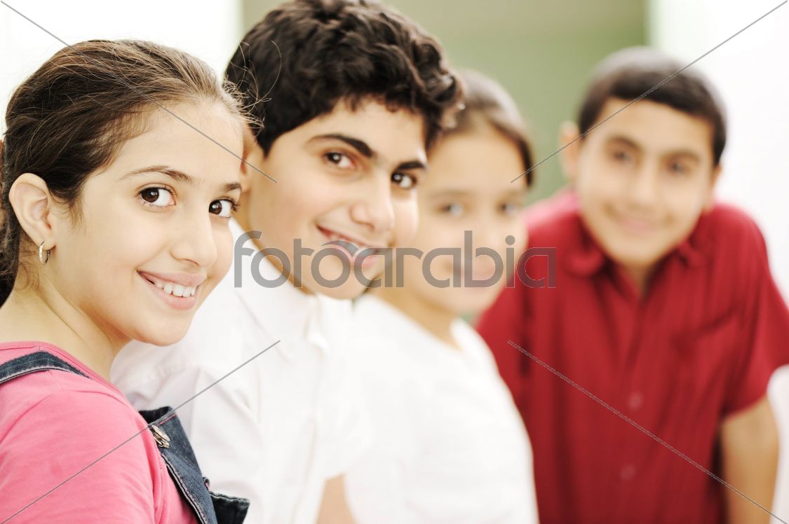Happy children smiling and laughing in the classroom