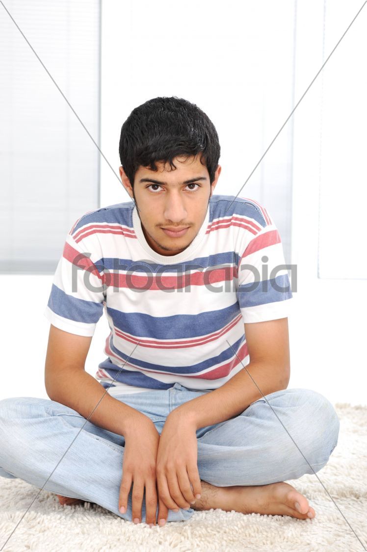 Cute teenage boy indoors
