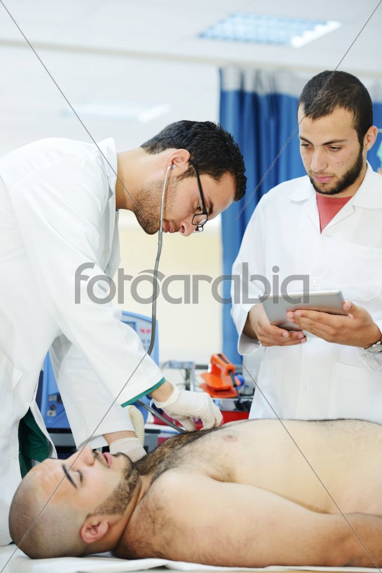 Active Arabic people posing in real hospital situation