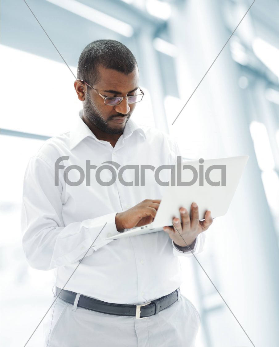 African American business man with a laptop