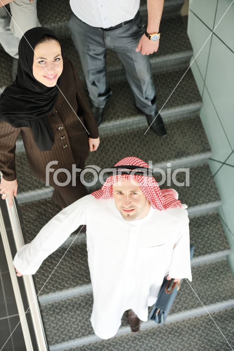 Group of multi ethnic business people at work on stairs