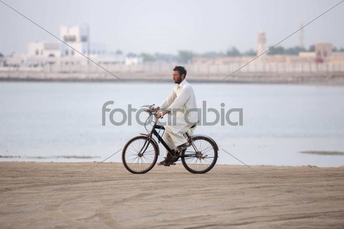 Pakistani Riding a Bicycle in Al Wakra