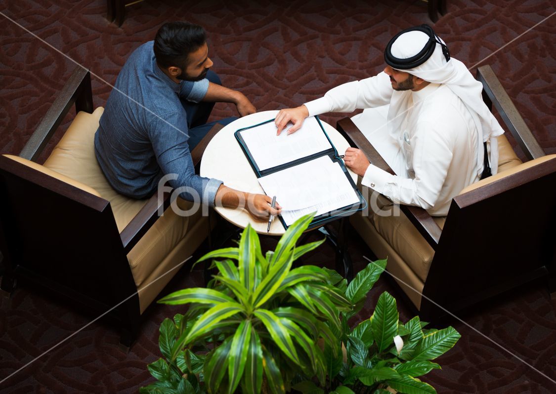 Two Qatari men having a meeting