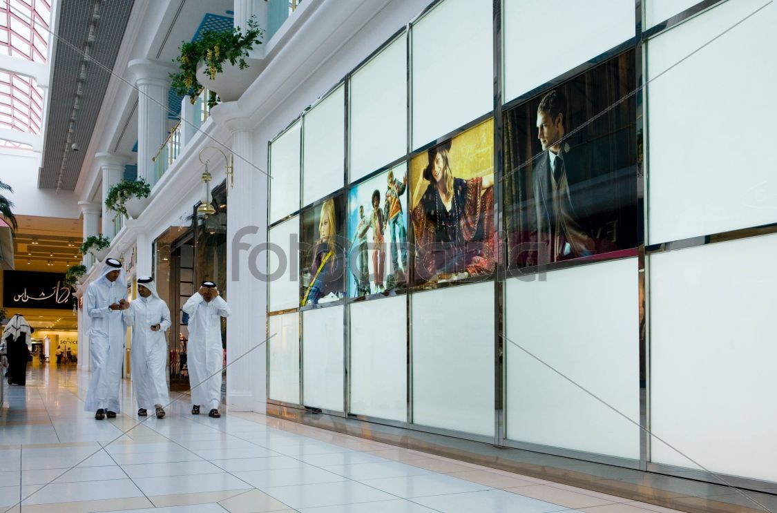 Men walking inside City Center Mall