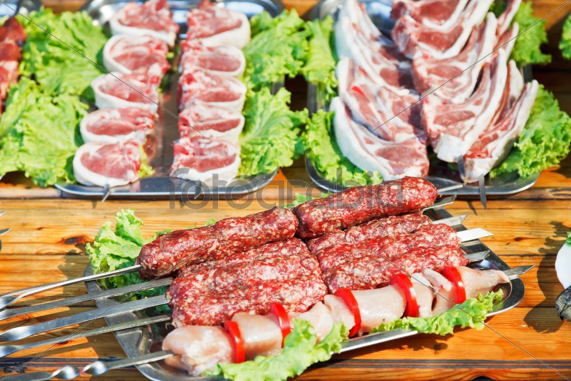 skewers of raw shish kebabs and lamb meat