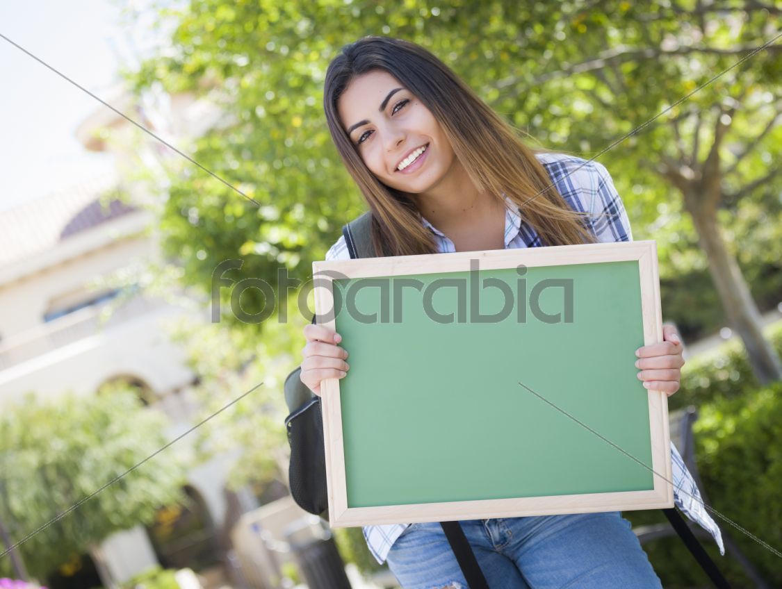Excited Mixed Race Female Student Holding Blank Chalkboard