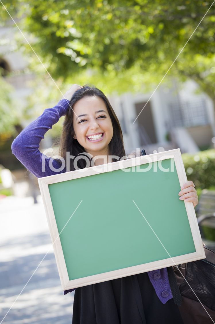 Excited Mixed Race Female Student Holding Blank Chalkboard
