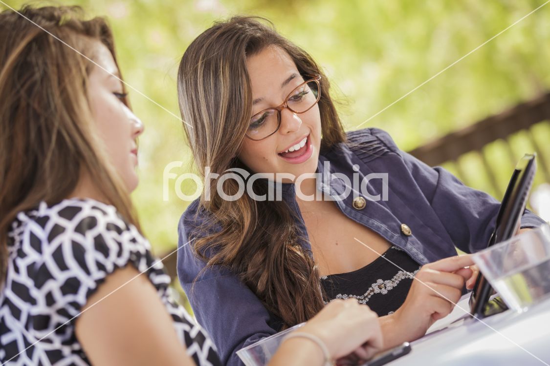 Mixed Race Girls Working Together on Tablet Computer