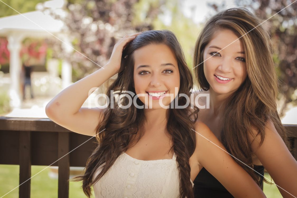 Attractive Mixed Race Girlfriends Smile Outdoors