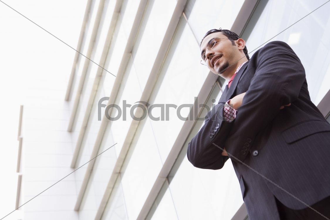 Businessman standing outstanding office