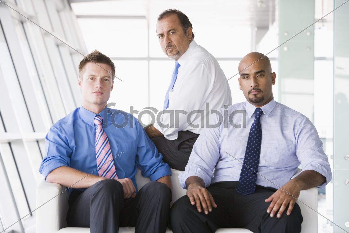 Group of businessmen sitting in lobby