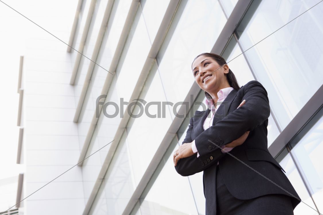 Businesswoman standing outside office building