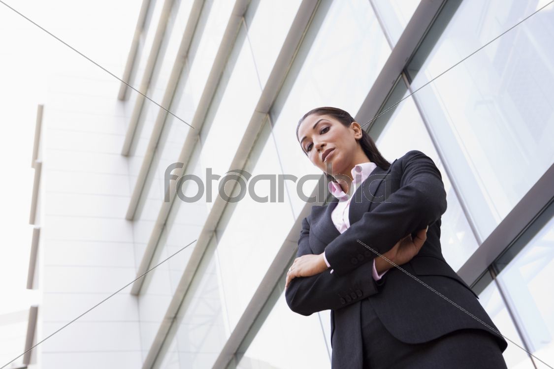 Businesswoman standing outside office building