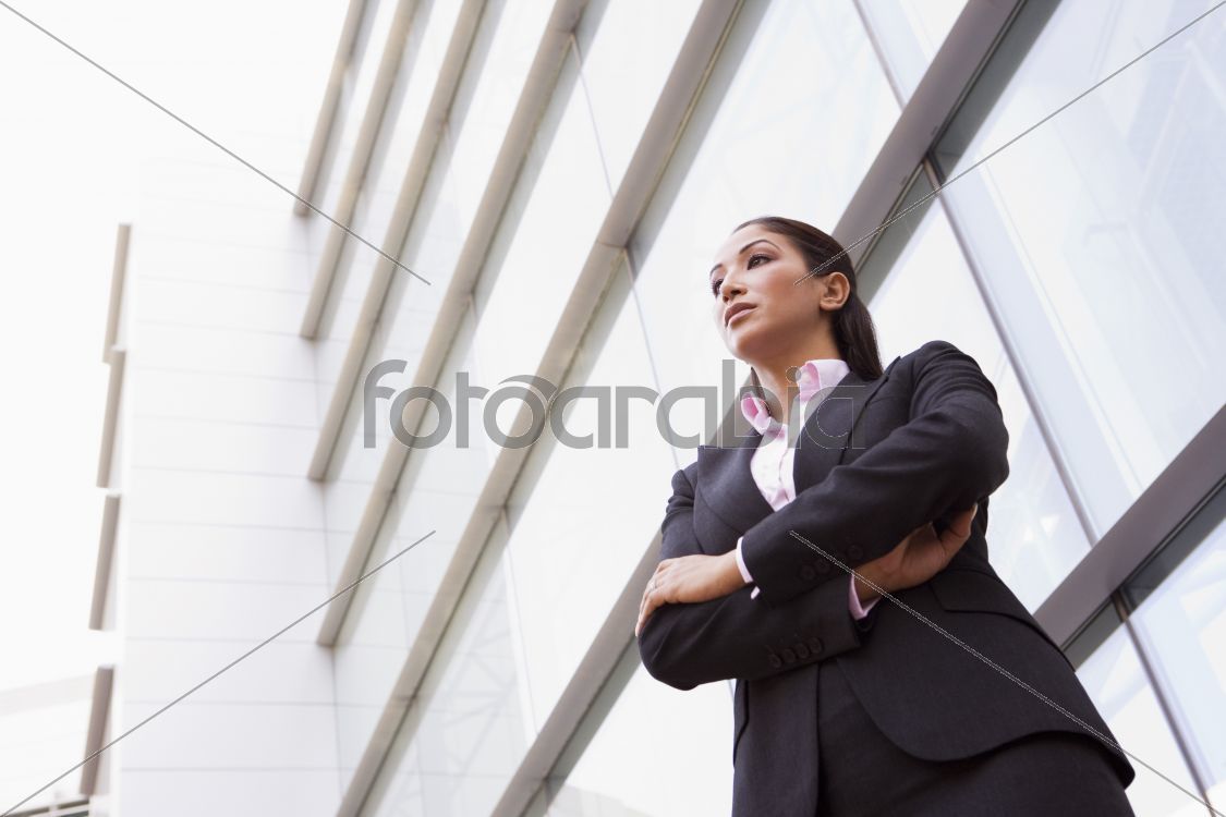Businesswoman standing outside office building