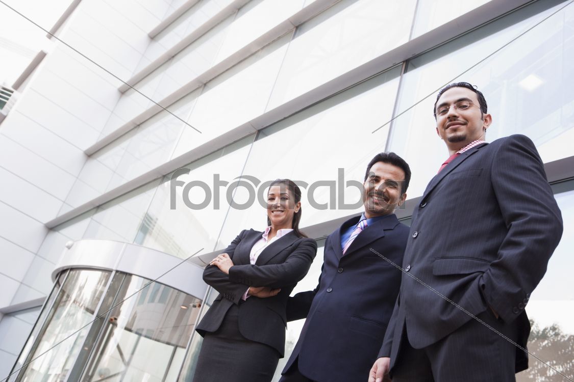 Group of business people outside office building
