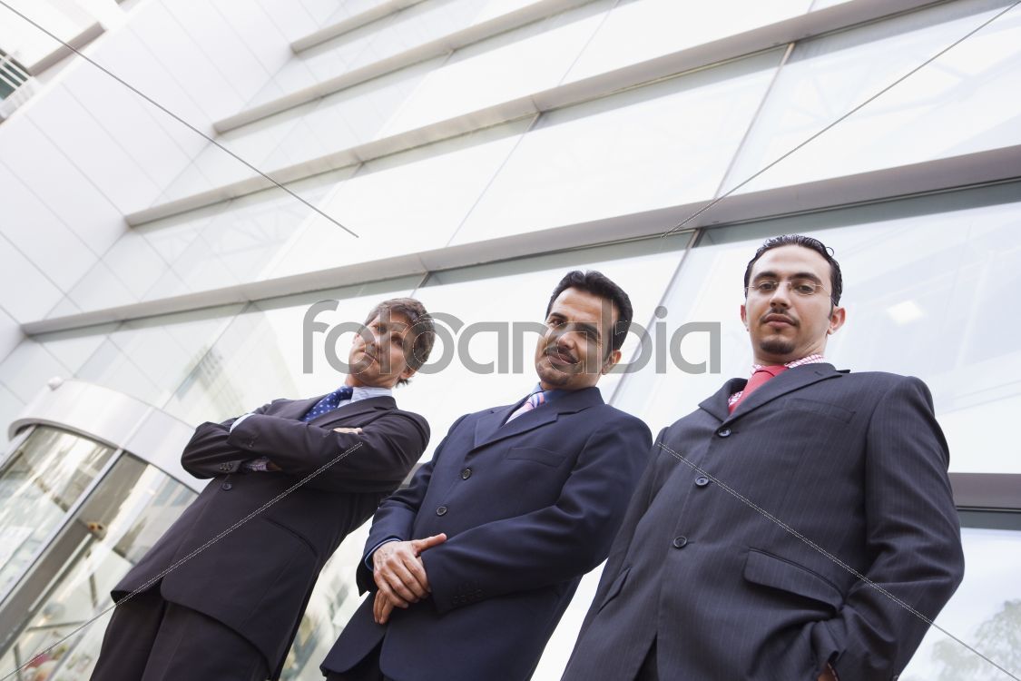 Group of businessmen outside office building