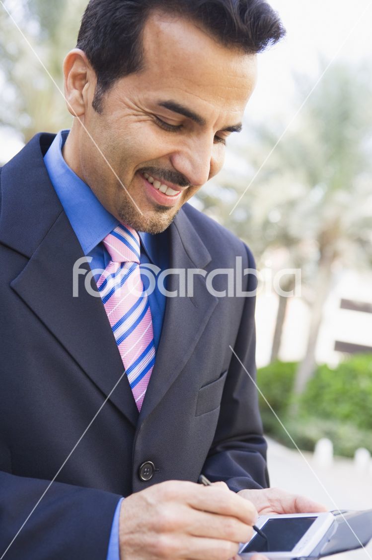 Businessman using PDA