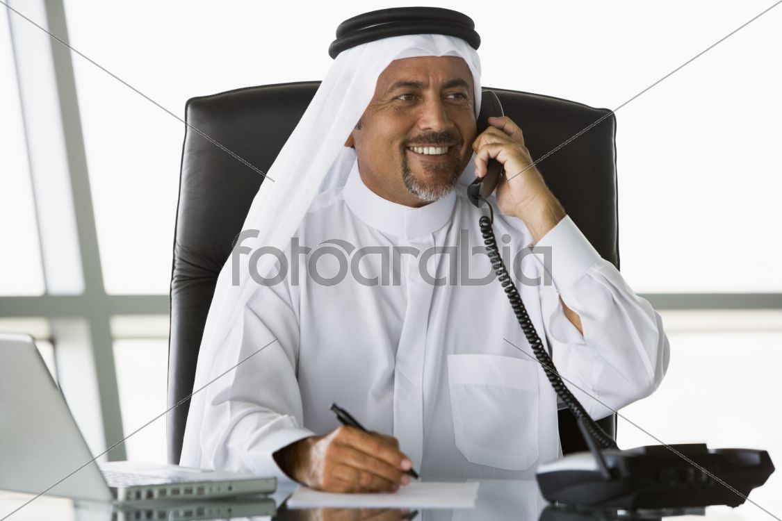 A Middle Eastern businessman talking on the telephone
