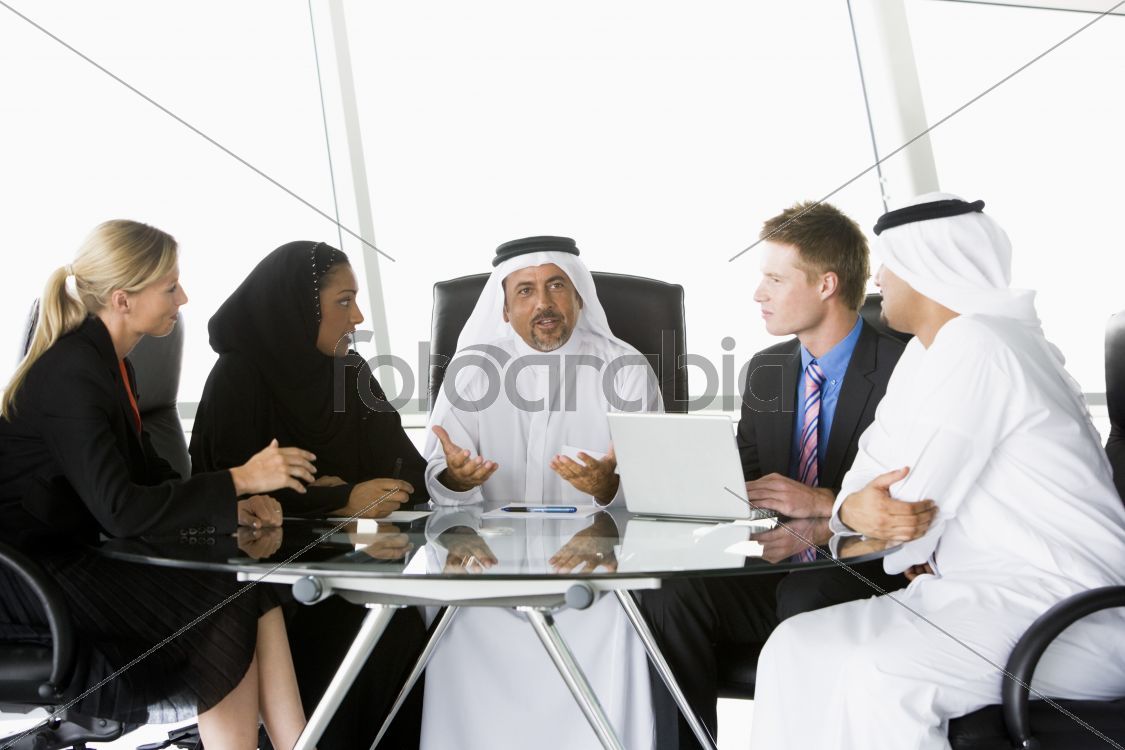 A  business meeting with Middle Eastern and caucasian men and wo