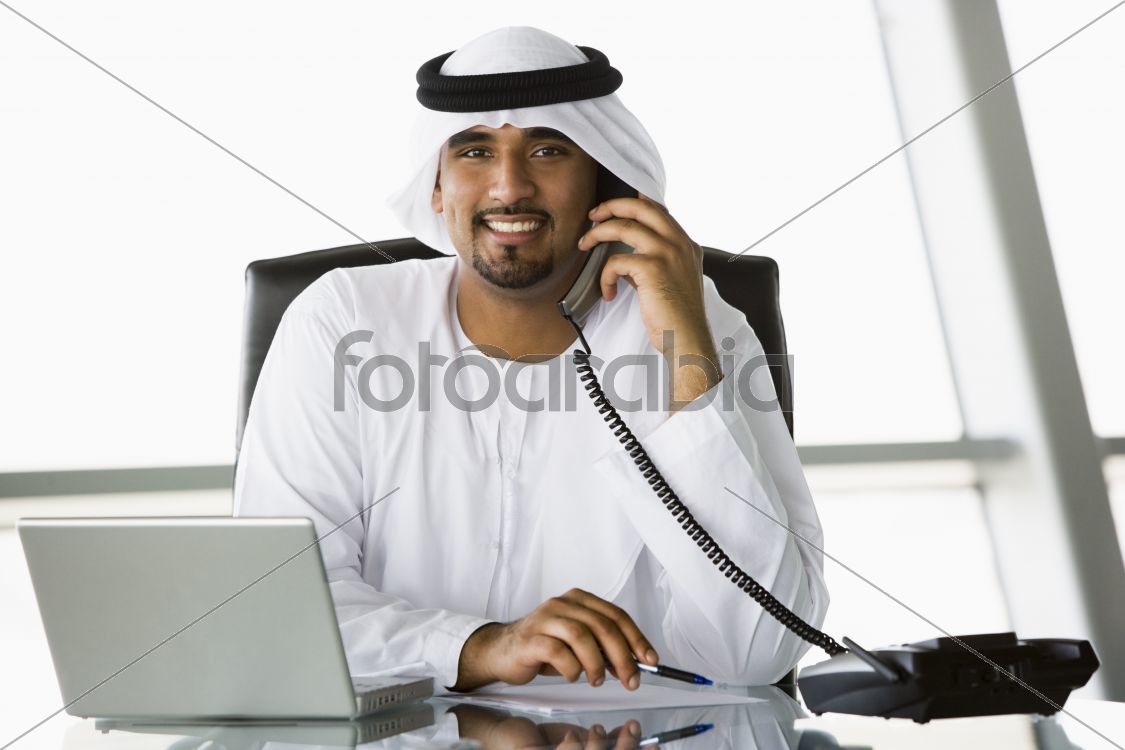 A Middle Eastern businessman talking on the telephone