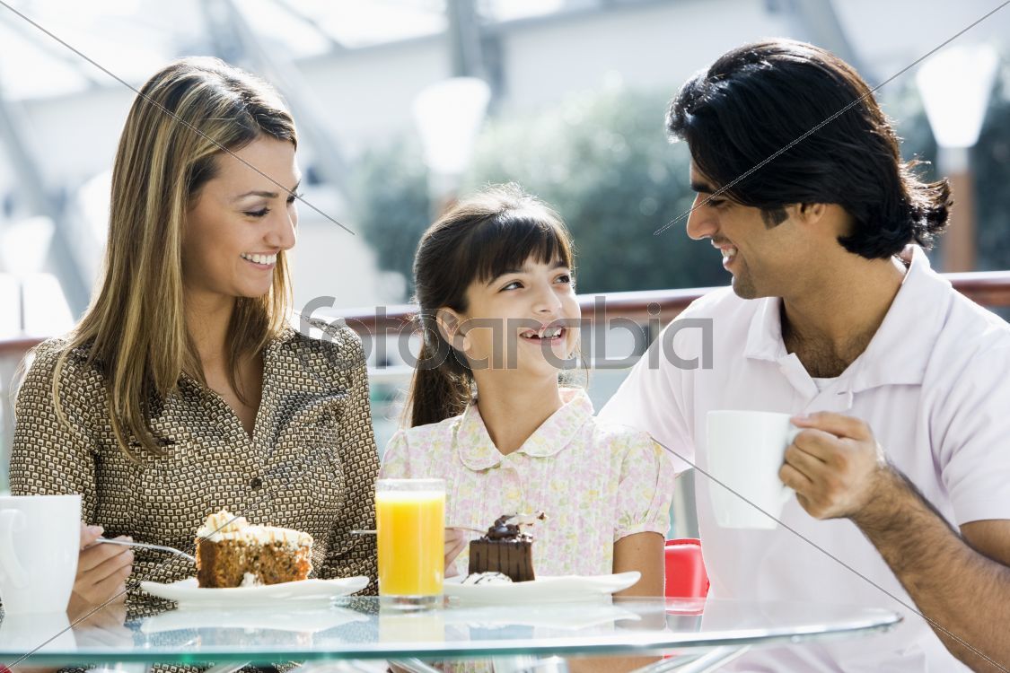 Family enjoying snack at cafe