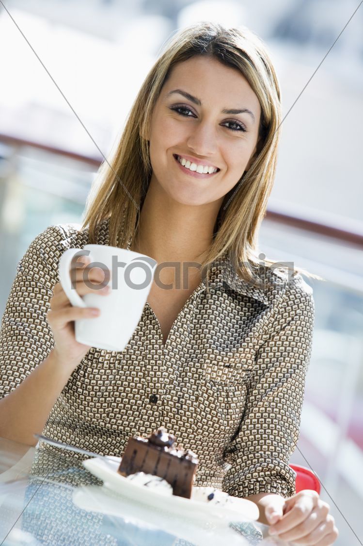 Woman enjoying snack at cafe