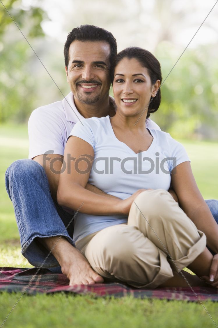 Couple relaxing in park