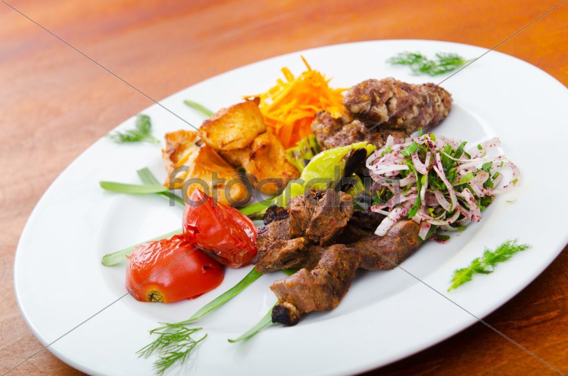 Plate with tasty lamp kebabs